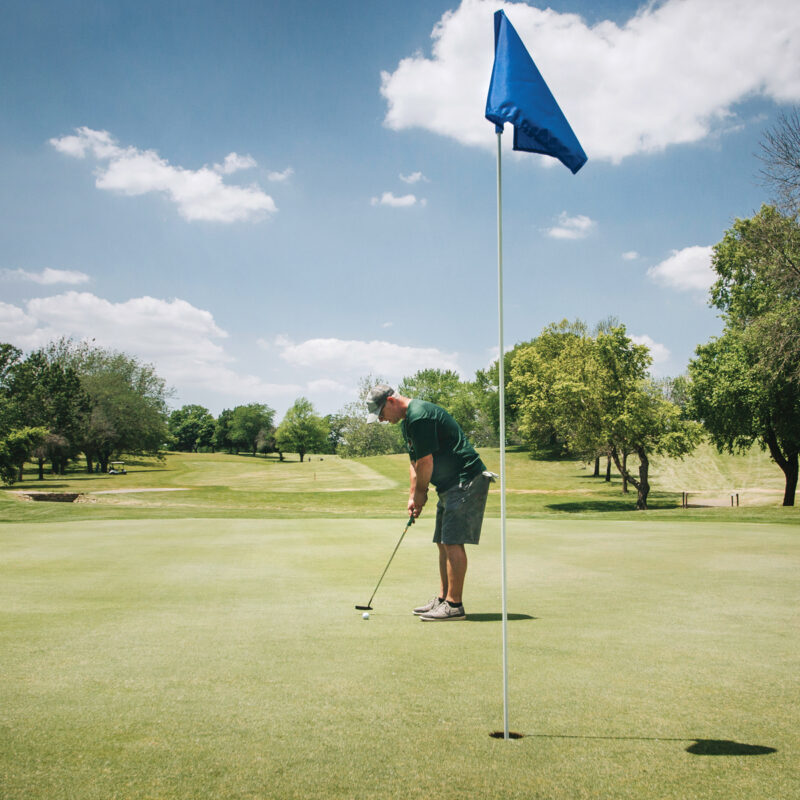 man playing golf on a green in Pekin