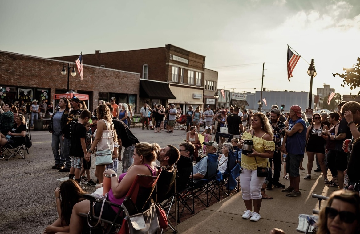 crowd camped out along a parade route